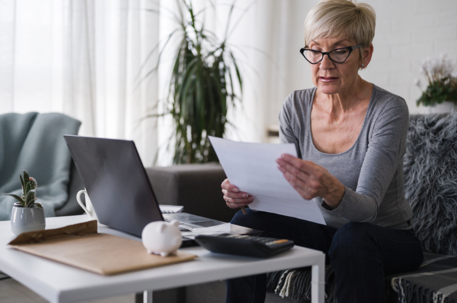 woman studying paper