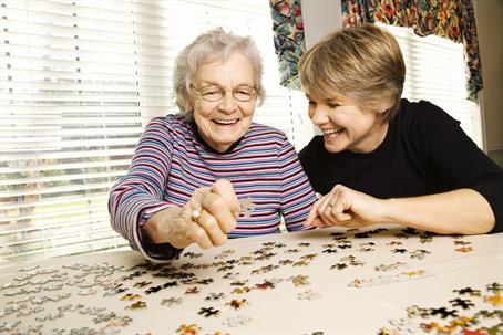 two people doing a puzzle